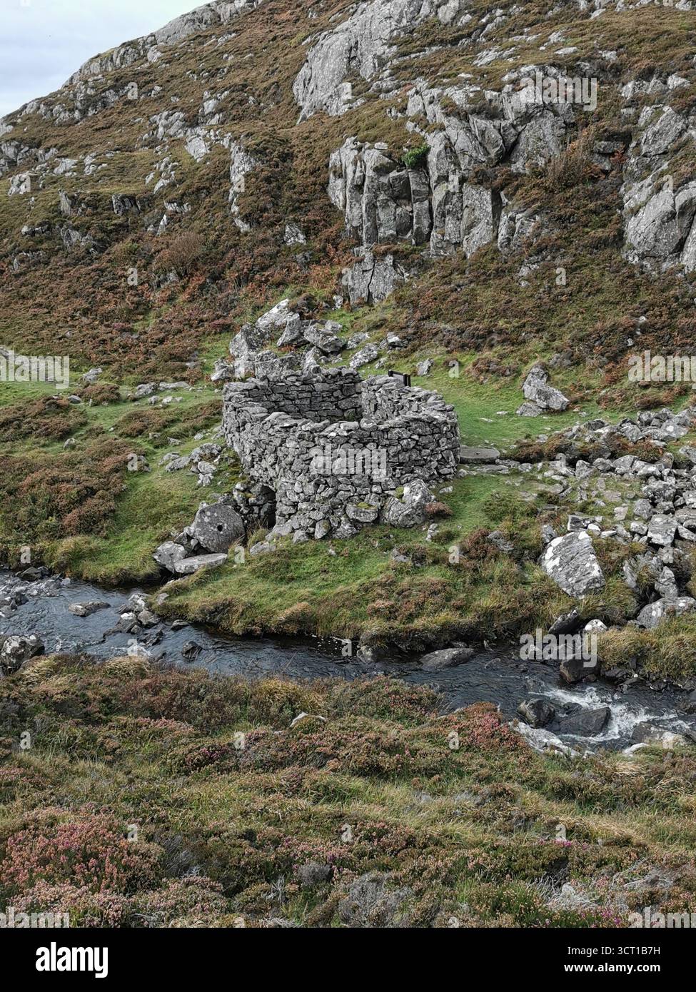 Alltanabradhan Mill, a Clearances-era ruin in the Scottish Highlands near Achmelvich on the NC500. Stone walls and old millstones still lie scattered. - Smartphone Captured Stock Image