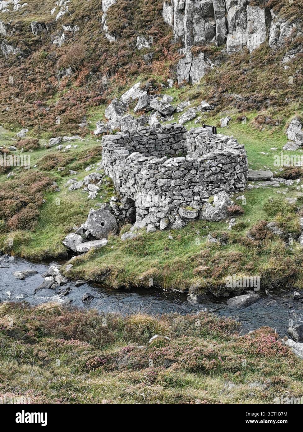 Alltanabradhan Mill, a Clearances-era ruin in the Scottish Highlands near Achmelvich on the NC500. Stone walls and old millstones still lie scattered. - Smartphone Captured Stock Image