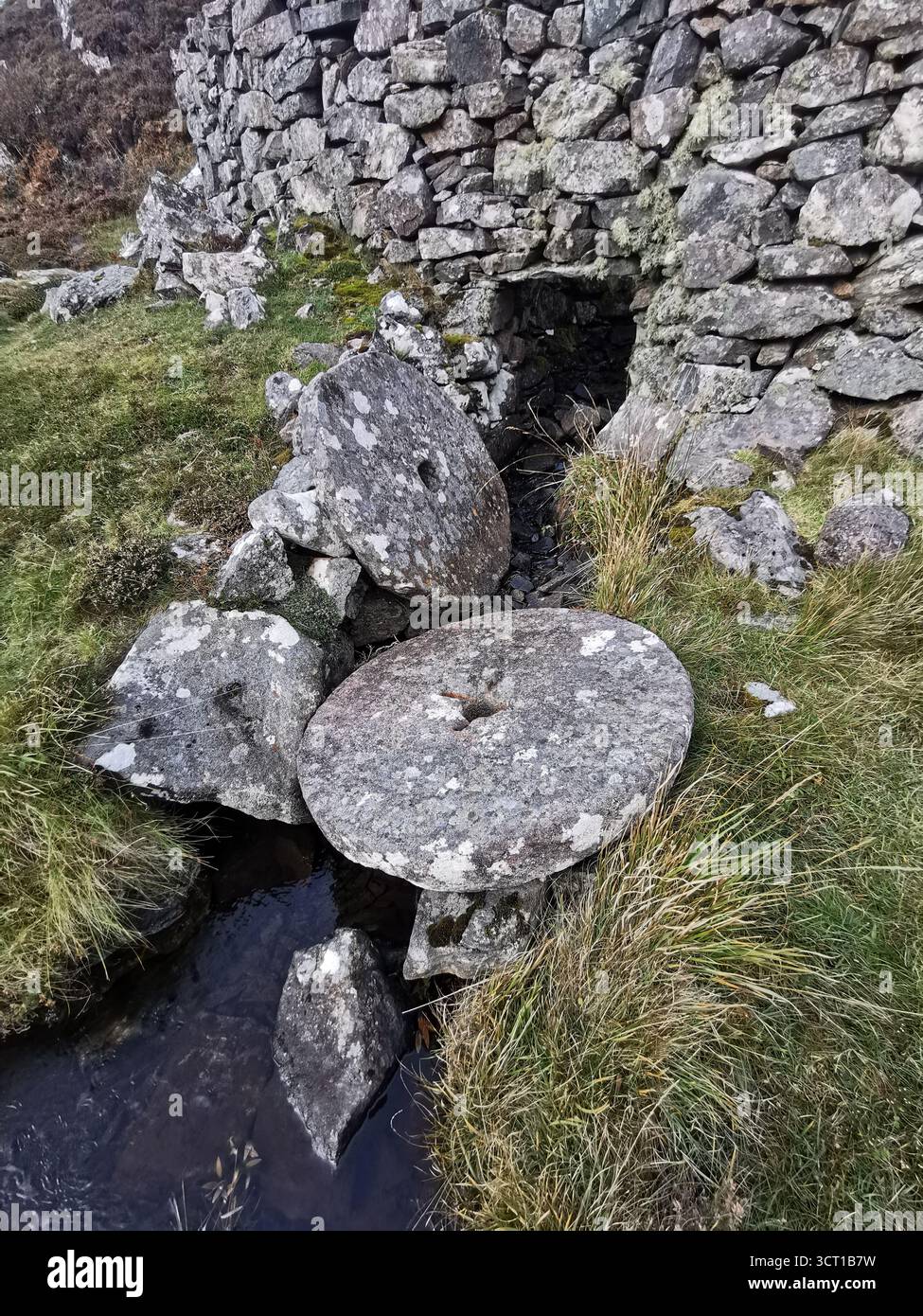 Alltanabradhan Mill, a Clearances-era ruin in the Scottish Highlands near Achmelvich on the NC500. Stone walls and old millstones still lie scattered. - Smartphone Captured Stock Image