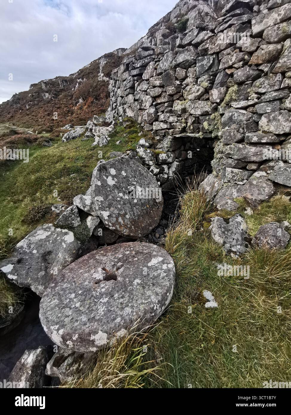 Alltanabradhan Mill, a Clearances-era ruin in the Scottish Highlands near Achmelvich on the NC500. Stone walls and old millstones still lie scattered. - Smartphone Captured Stock Image