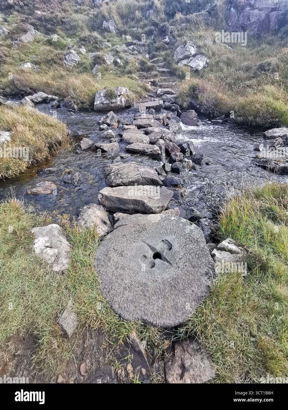 Alltanabradhan Mill, a Clearances-era ruin in the Scottish Highlands near Achmelvich on the NC500. Stone walls and old millstones still lie scattered. - Smartphone Captured Stock Image