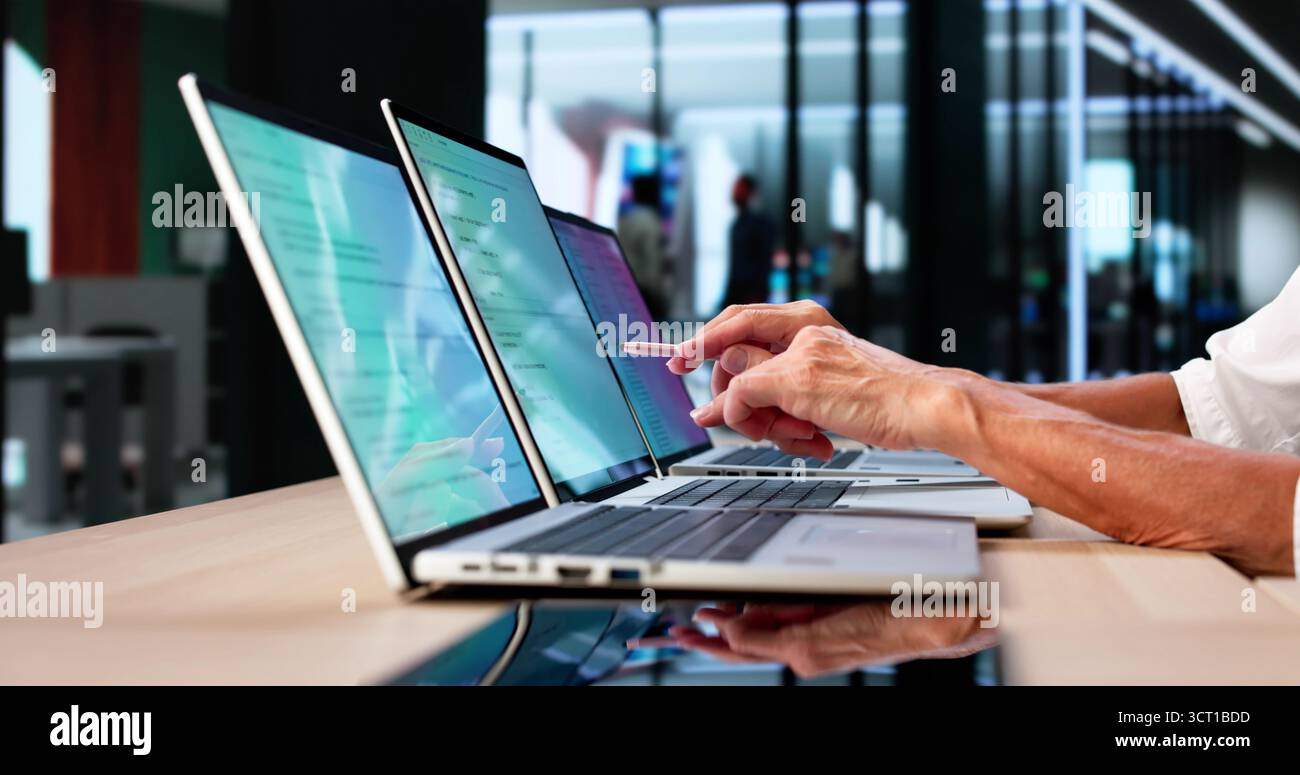 Developer Office: Coding And Developing Software On Computer Screens Stock Photo