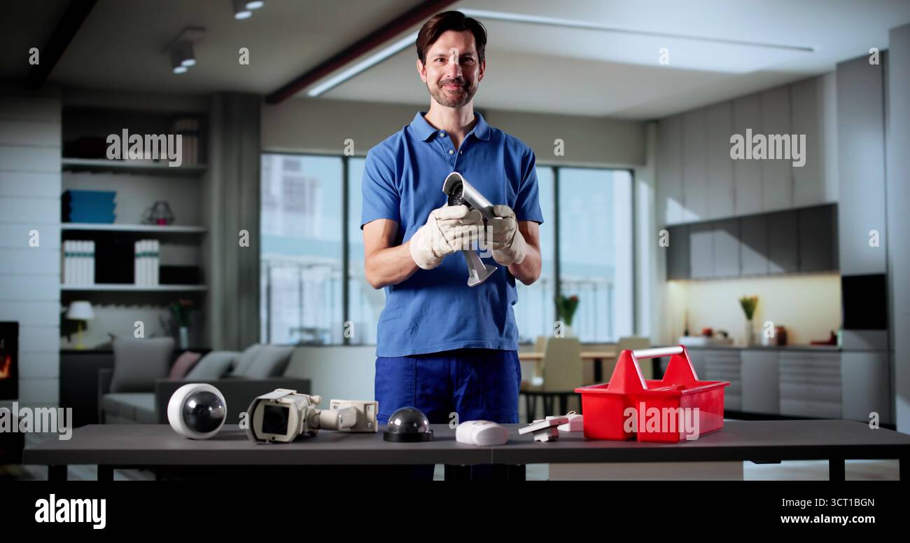 Elderly Technician Smiling While Installing Surveillance Security Camera System Stock Photo