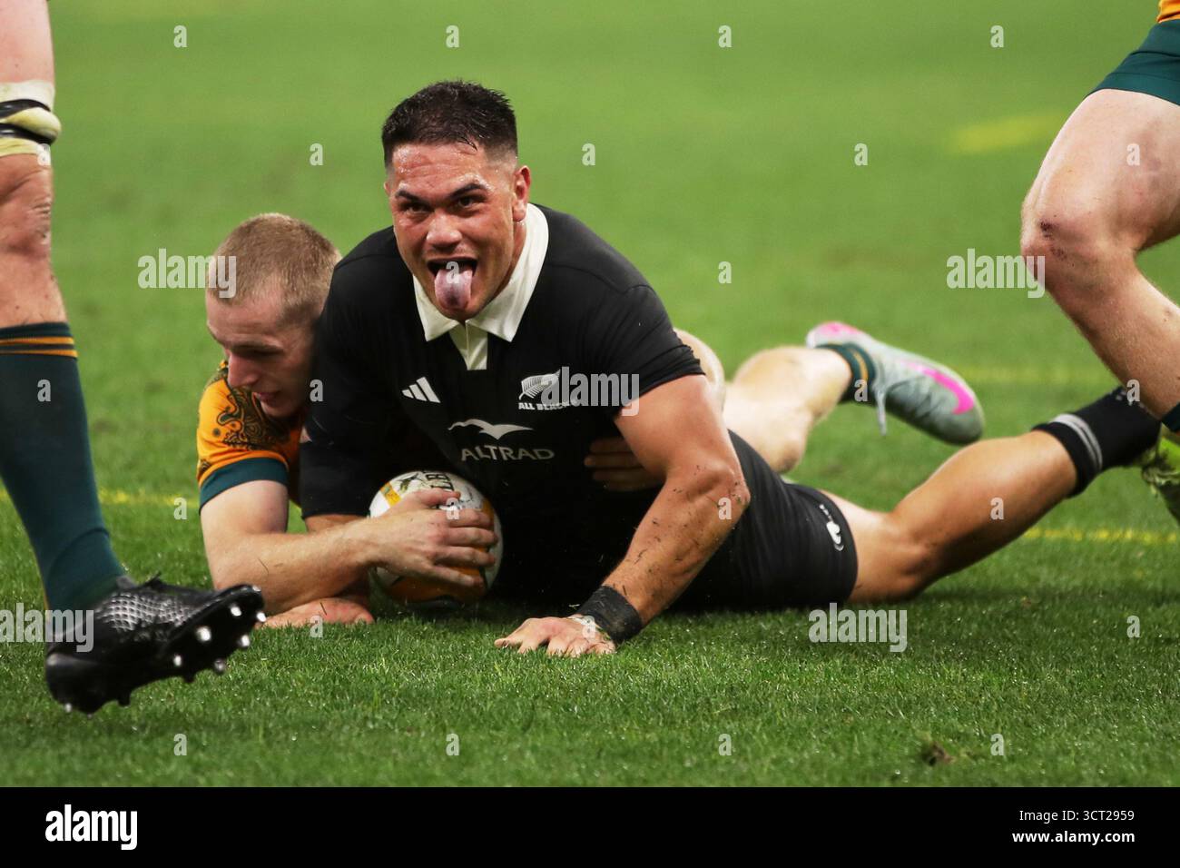 New Zealand's Quinn Tupaea reacts after scoring a try during the ...