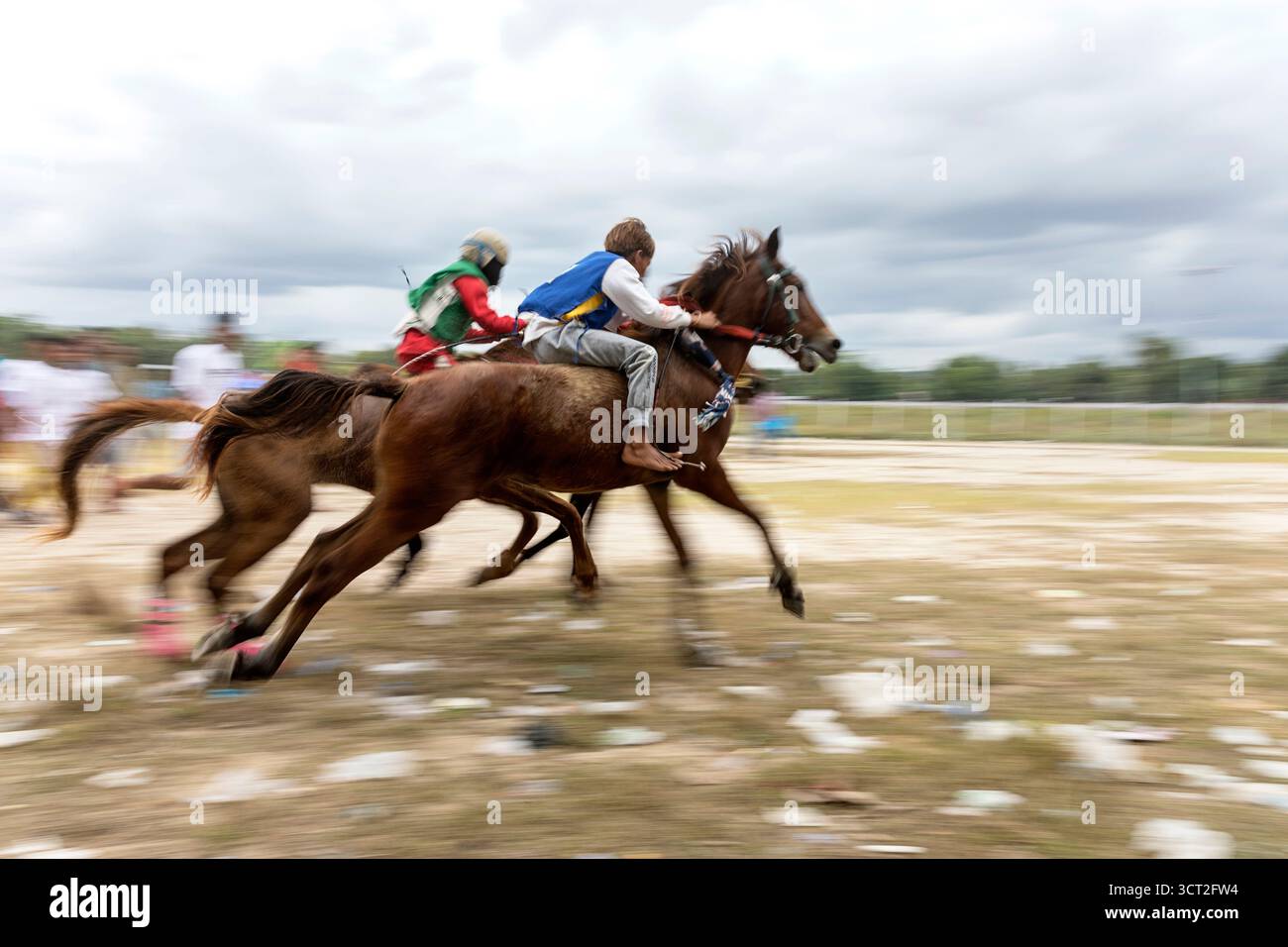 Traditional horse races in Waingapu on Sumba island in Indonesia, Stock Photo