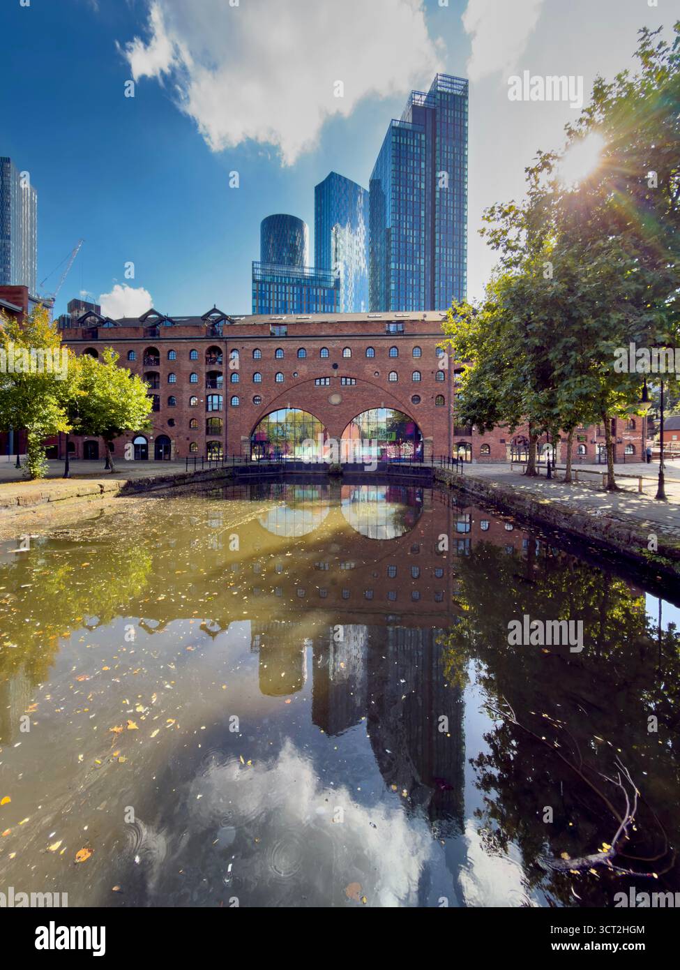 Castlefield basin and River Medlock with towers of Deansgate Square complex in background in Manchester City centre - Smartphone Captured Stock Image