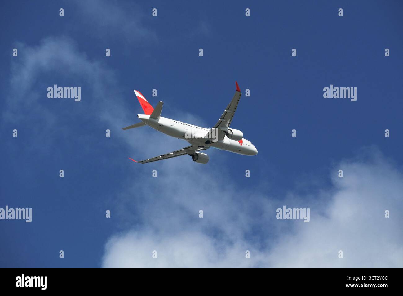 Airplane in the blue sky. Stock Photo