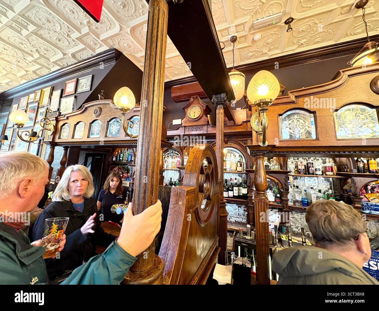 Red Lion pub London England, famous Whitehall pub near Downing Street, customers inside enjoy lunch and a pint beer drinks, UK - Smartphone Captured Stock Image