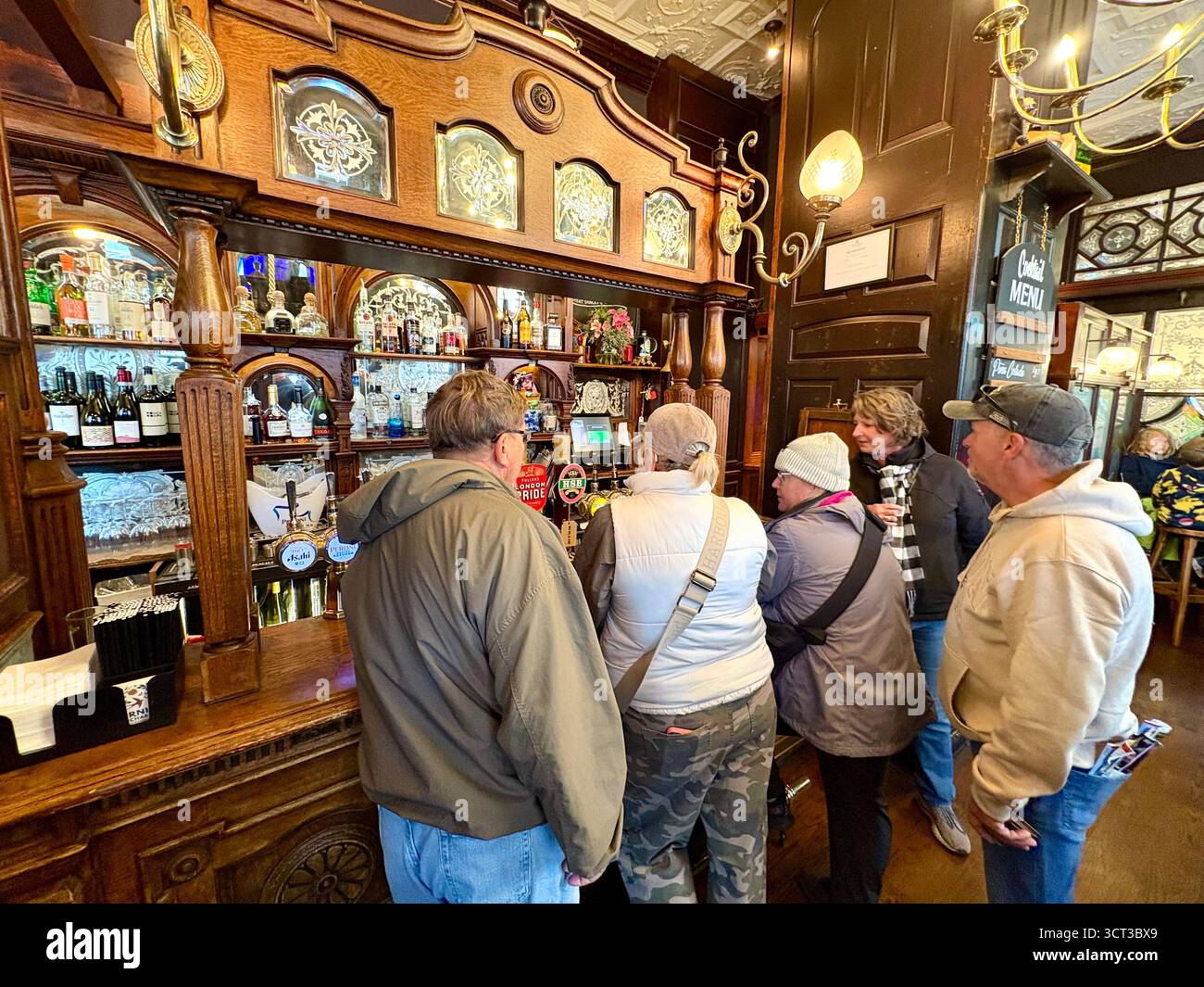 Red Lion pub London England, famous Whitehall pub near Downing Street, customers inside enjoy lunch and a pint beer drinks, UK - Smartphone Captured Stock Image