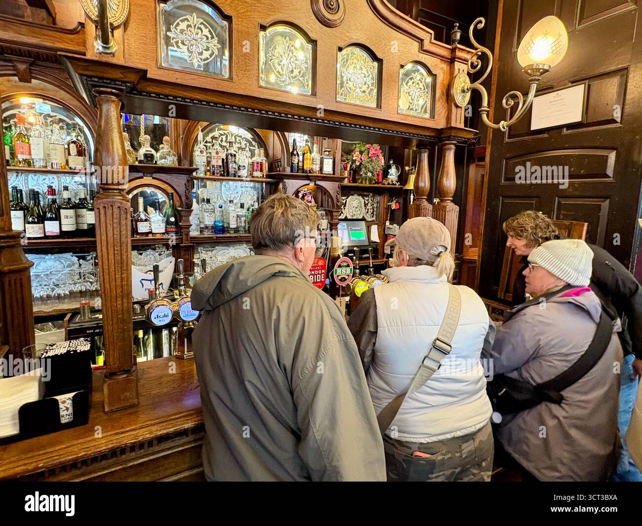 Red Lion pub London England, famous Whitehall pub near Downing Street, customers inside enjoy lunch and a pint beer drinks, UK - Smartphone Captured Stock Image