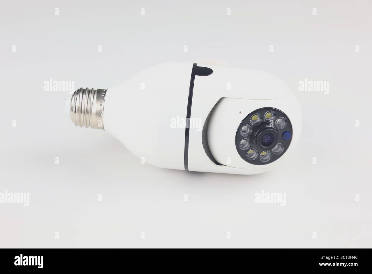 This image shows a white smart bulb-shaped IP camera against a plain white background. Stock Photo