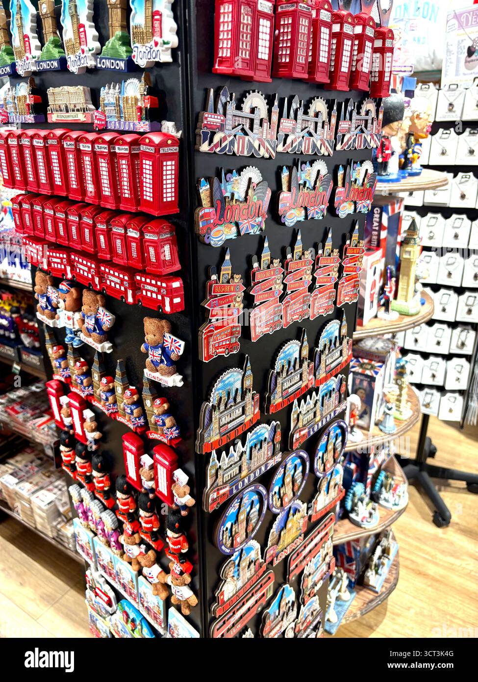 London souvenirs, fridge magnets London phone box, London bus, in souvenir shop in central London - Smartphone Captured Stock Image