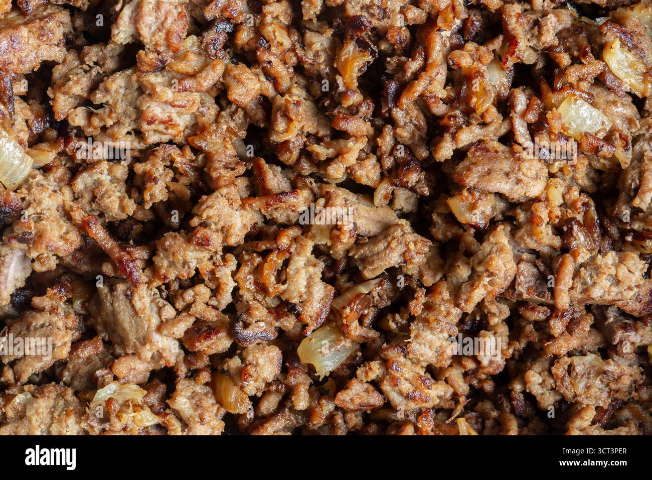 Fried lean beef steak mince with onions fried background backdrop. Stock Photo