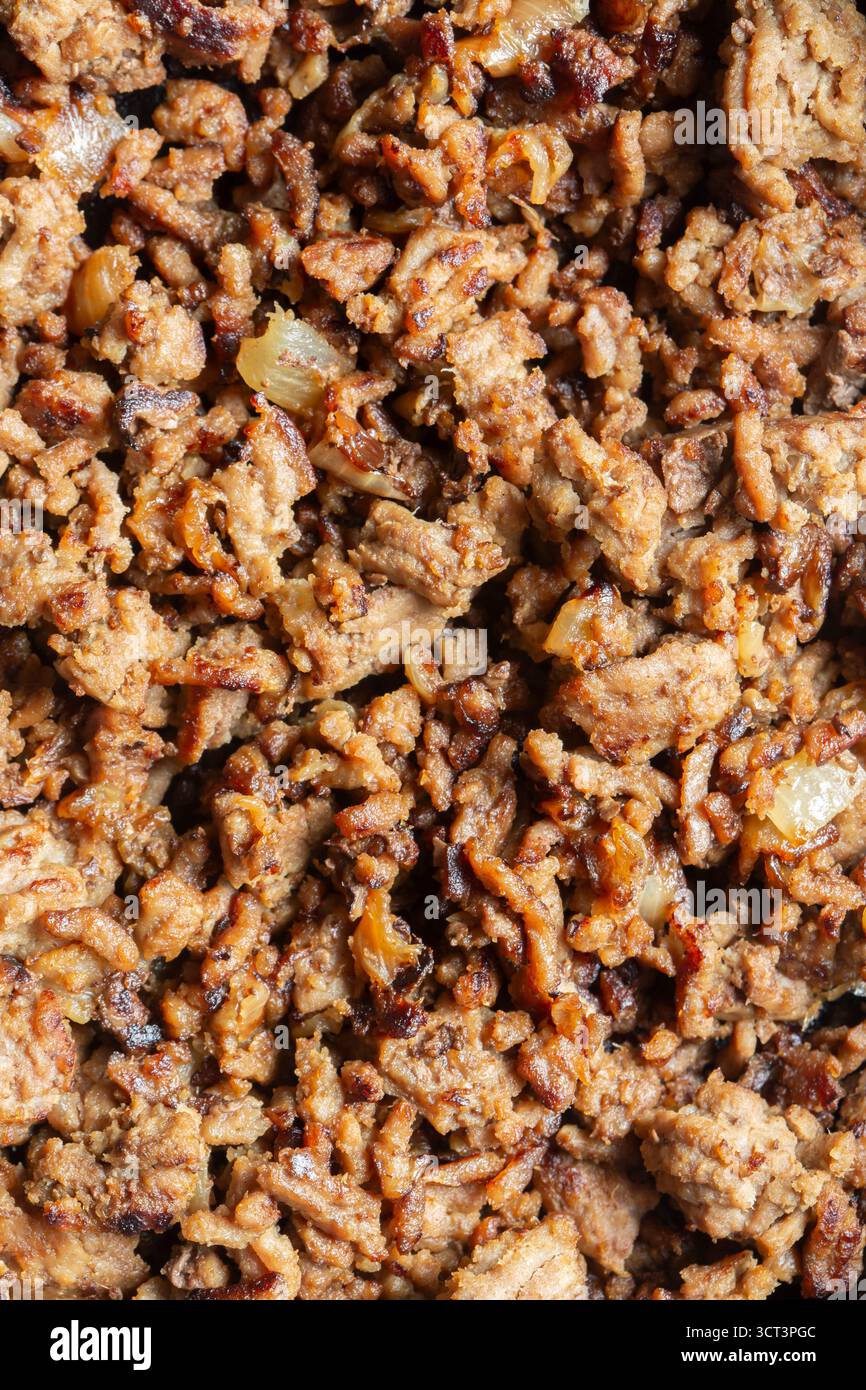Fried lean beef steak mince with onions fried background backdrop. Stock Photo