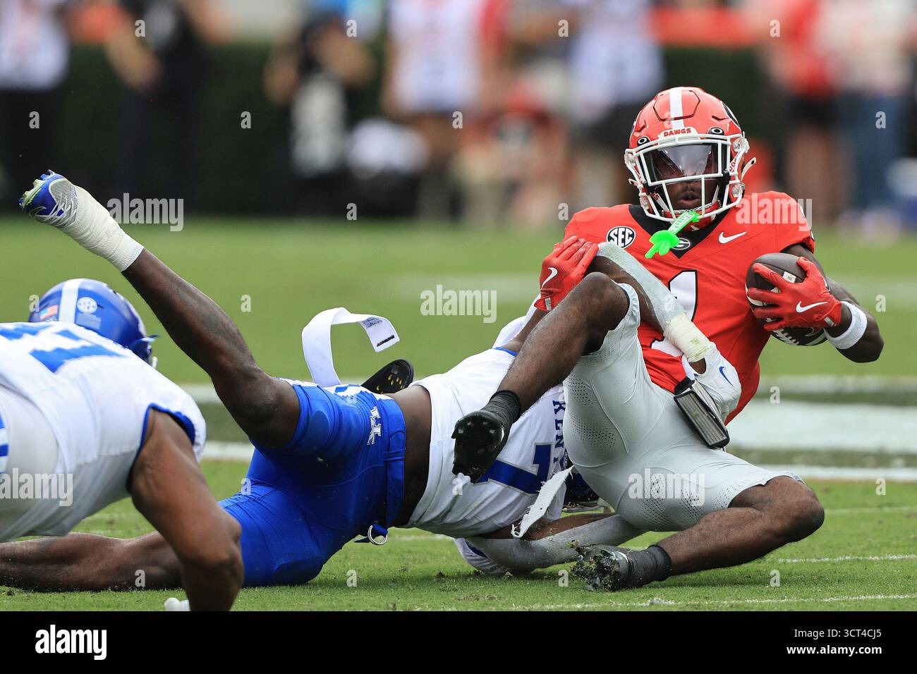 ATHENS, GA - OCTOBER 04: Daveren Rayner #7 tackles Zachariah Branch #1 ...