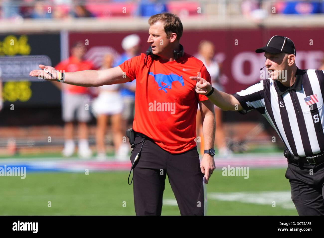 SMU head coach Rhett Lashlee, left, makes a point with an official ...