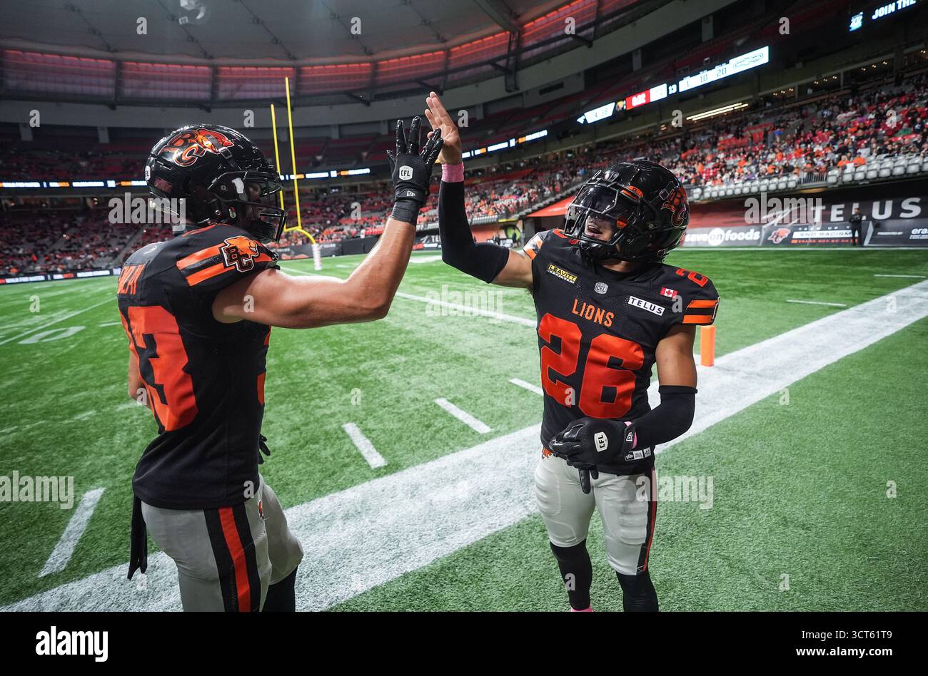 B.C. Lions' Robert Carter Jr., right, celebrates his interception with ...