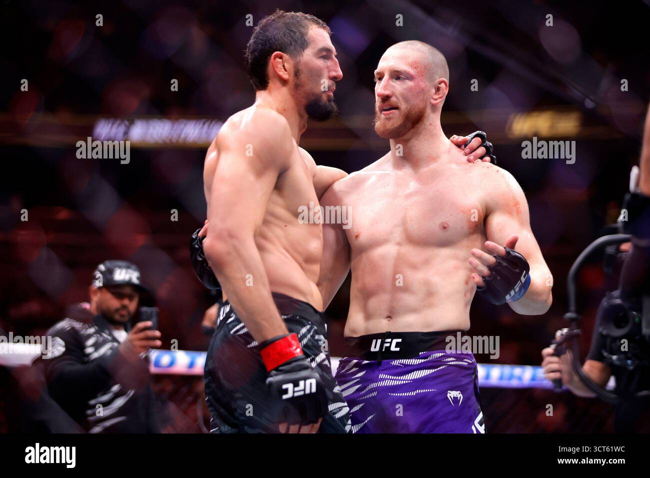 Joe Pyfer, right, of the United States, talks with Arbus Magomedov ...