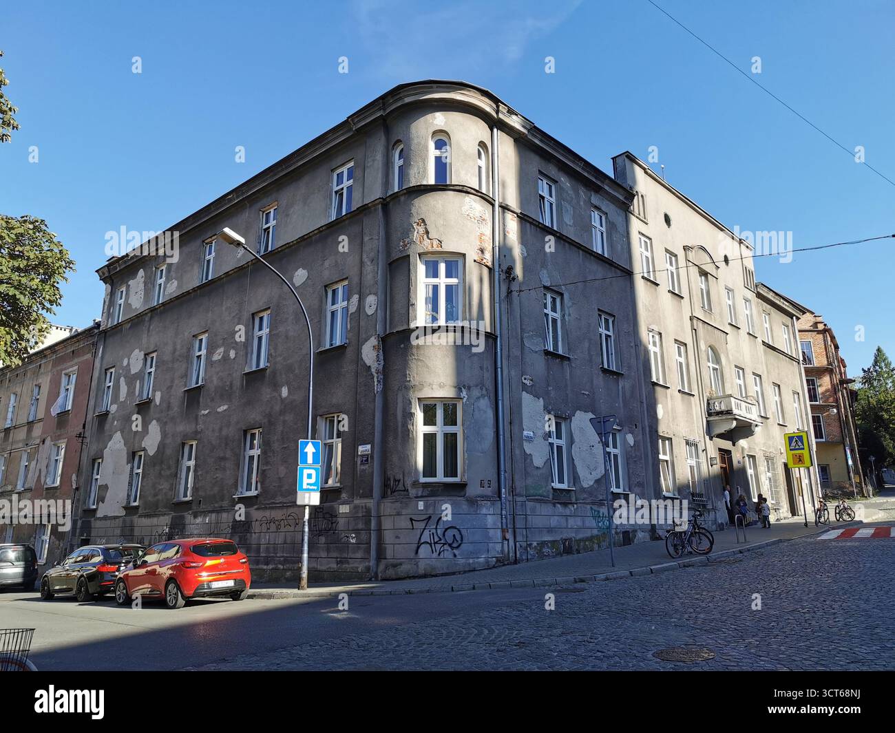 Tiny door on Ulica Rękawka, Kraków—used when main Parkowa entrance was bricked up—marks Roman Polanski’s wartime home in the Kraków Ghetto, Podgórze. - Smartphone Captured Stock Image