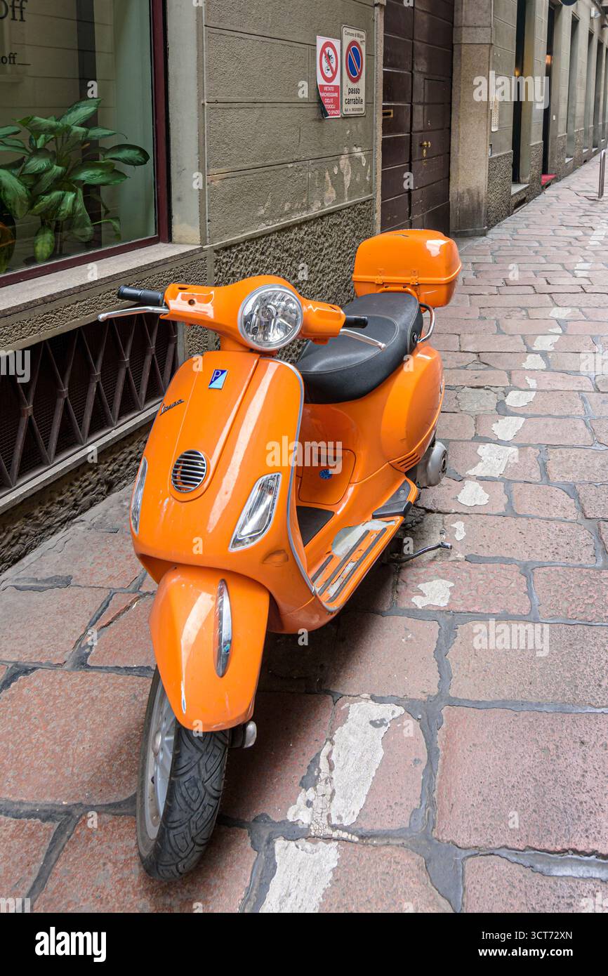 Piaggio Vespa Scooter parked in the old streets of Centro Storico, Milan, Italy Stock Photo