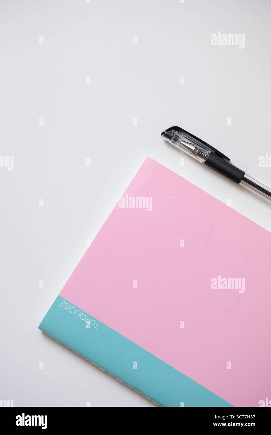 A notebook and a pen isolated on a white background Stock Photo