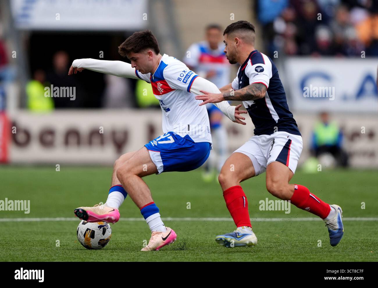 Rangers' Mikey Moore (left) and Falkirk's Leon McCann battle for the ball  during the William Hill Premiership match at Falkirk Stadium, Falkirk.  Picture date: Sunday October 5, 2025 Stock Photo - Alamy