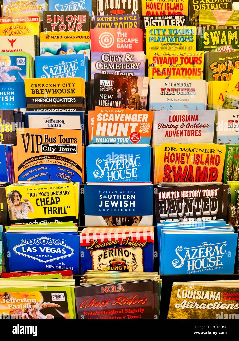 New Colorful brochures promoting tours, attractions, and adventures in New Orleans and Louisiana fill a display rack, advertising swamp tours, distill - Smartphone Captured Stock Image