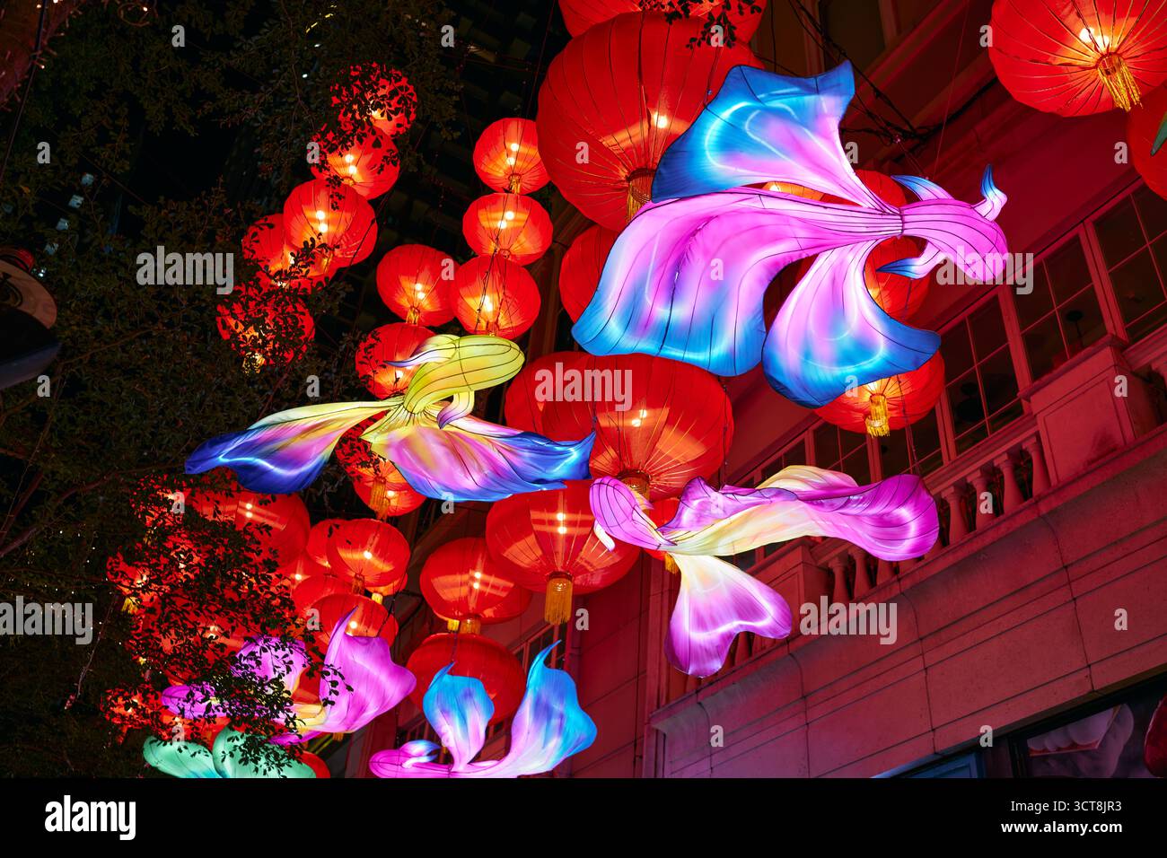 Wan Chai, Hong Kong - Sep 30 2025: Lee Tung Street under the sea of illuminated red lanterns and colorful fish lanterns near Moon Festival at night. Stock Photo