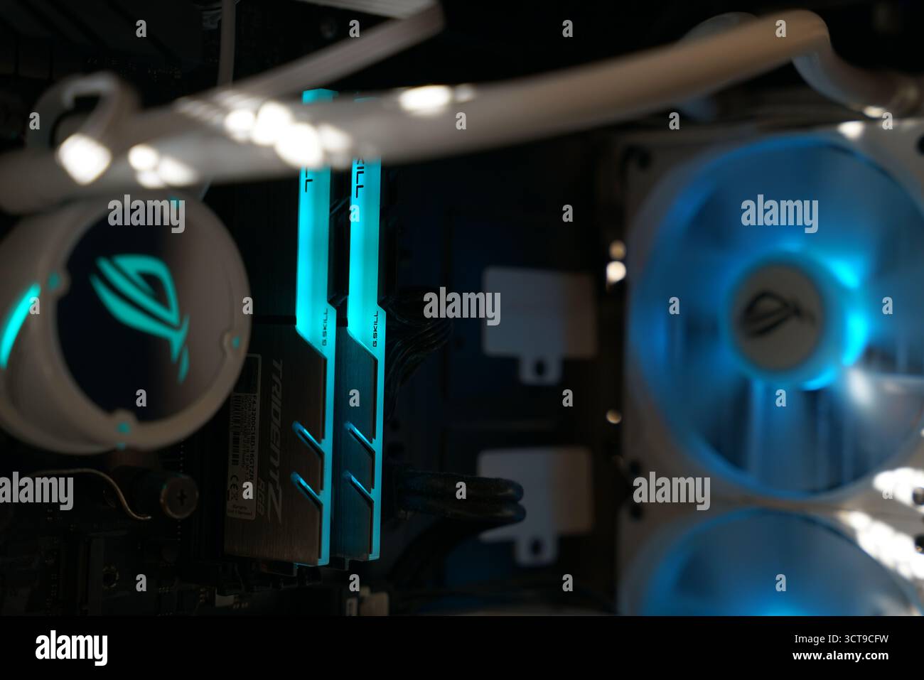 High-performance gaming PC components with glowing lights in a modern setup Stock Photo