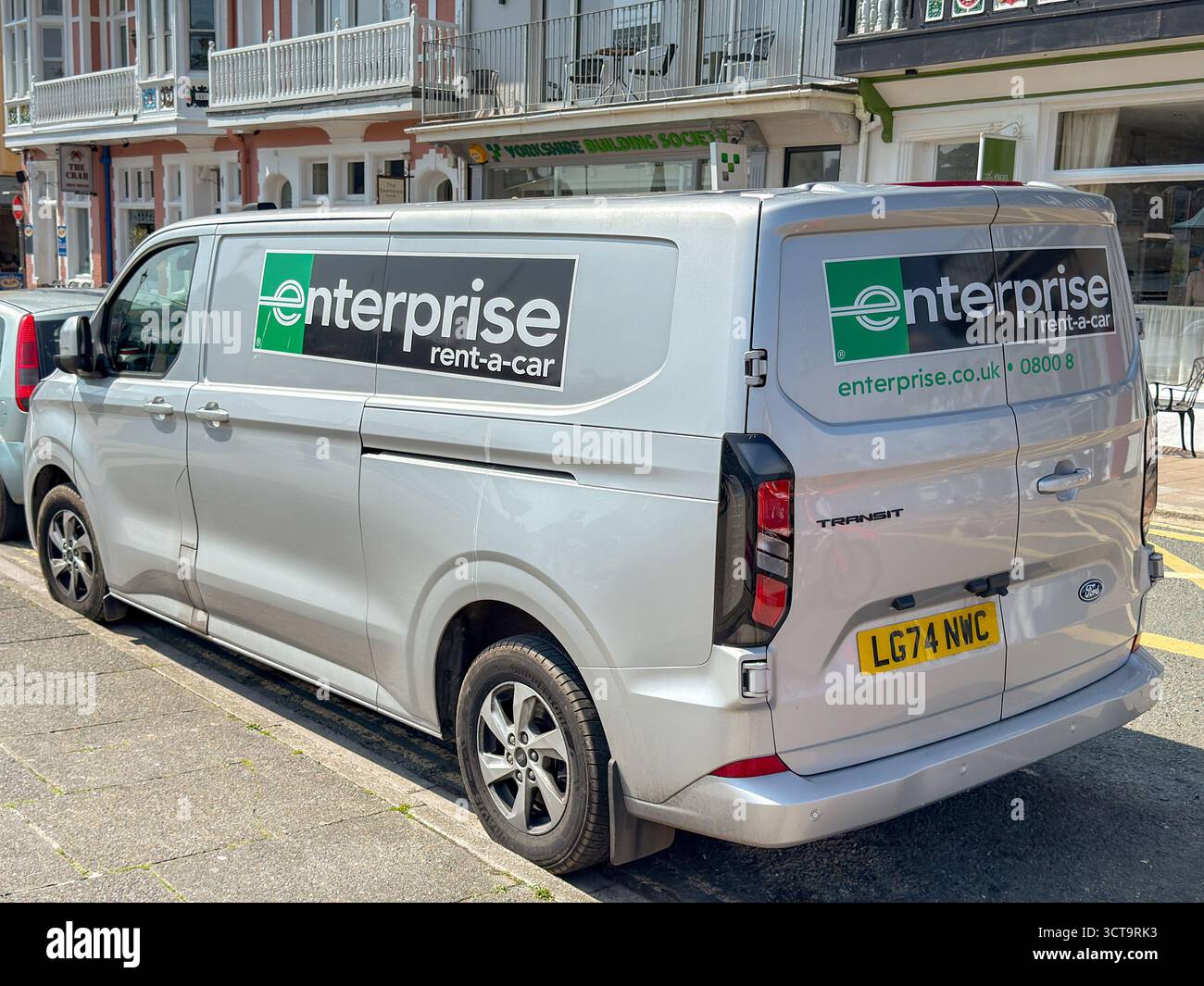 Dartmouth, Devon, England, UK - 24 April 2025: Van owned by rental company Enterprise rent-a-car parked in the town of Dartmouth - Smartphone Captured Stock Image