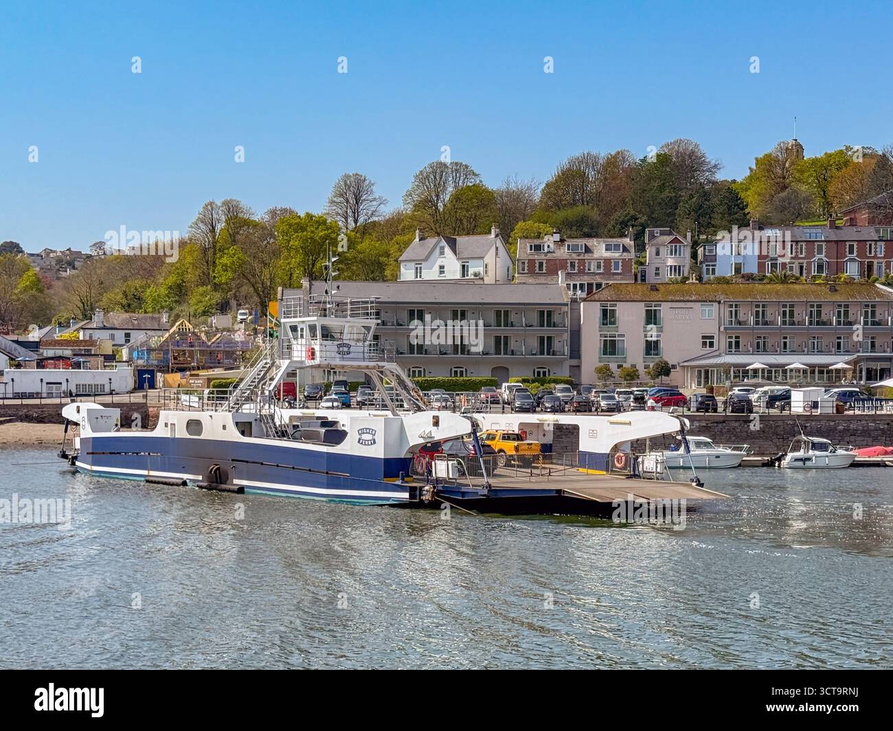 Kingswear, Devon, England, UK - 24 April 2025: Kingswear Higher ferry about to depart the town of Dartmouth with vehicles on board to cross the River - Smartphone Captured Stock Image