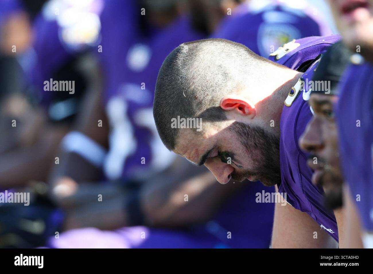 Baltimore Ravens tight end Mark Andrews holds his head down while ...