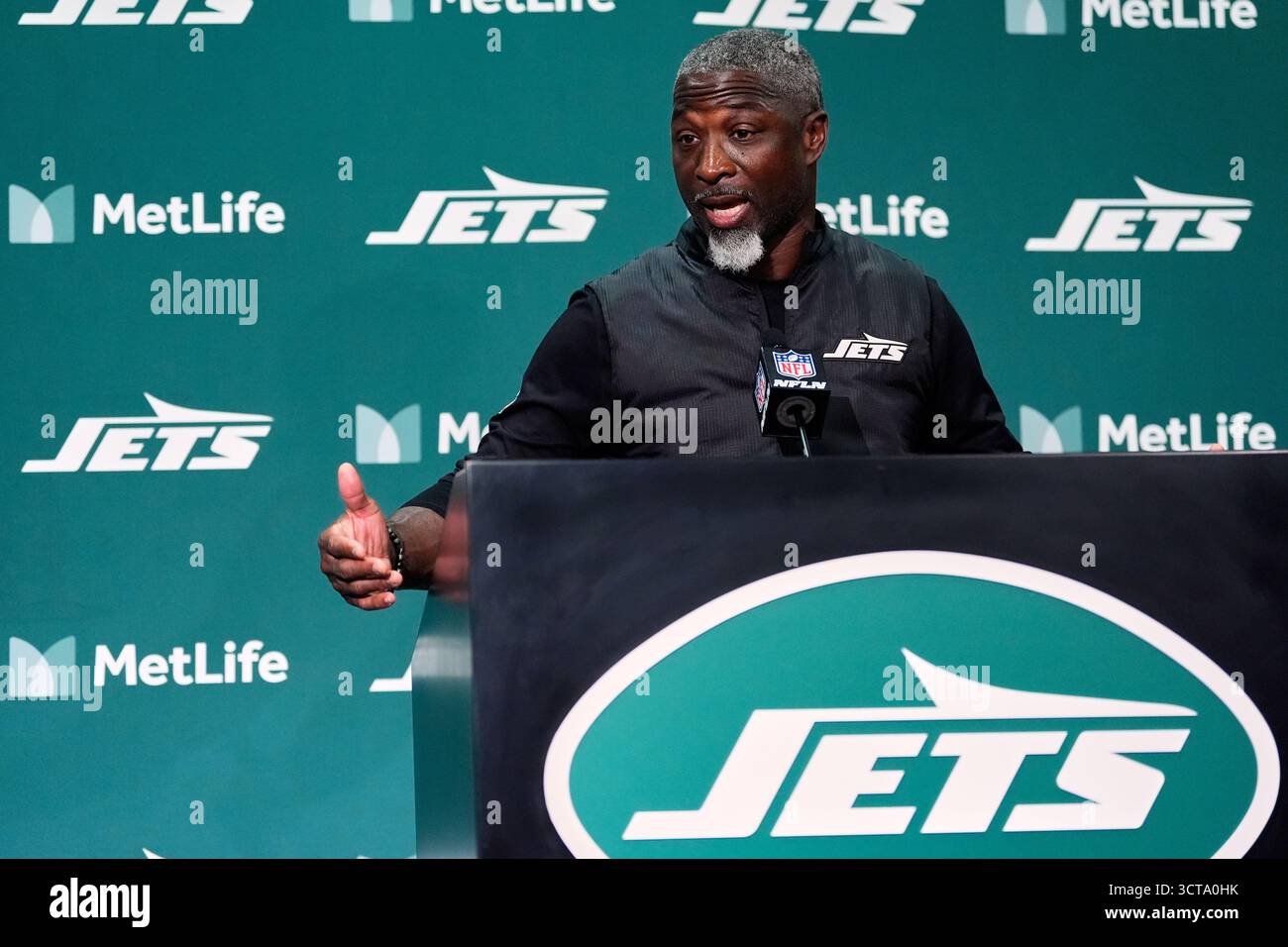 New York Jets head coach Aaron Glenn talks after an NFL football game ...