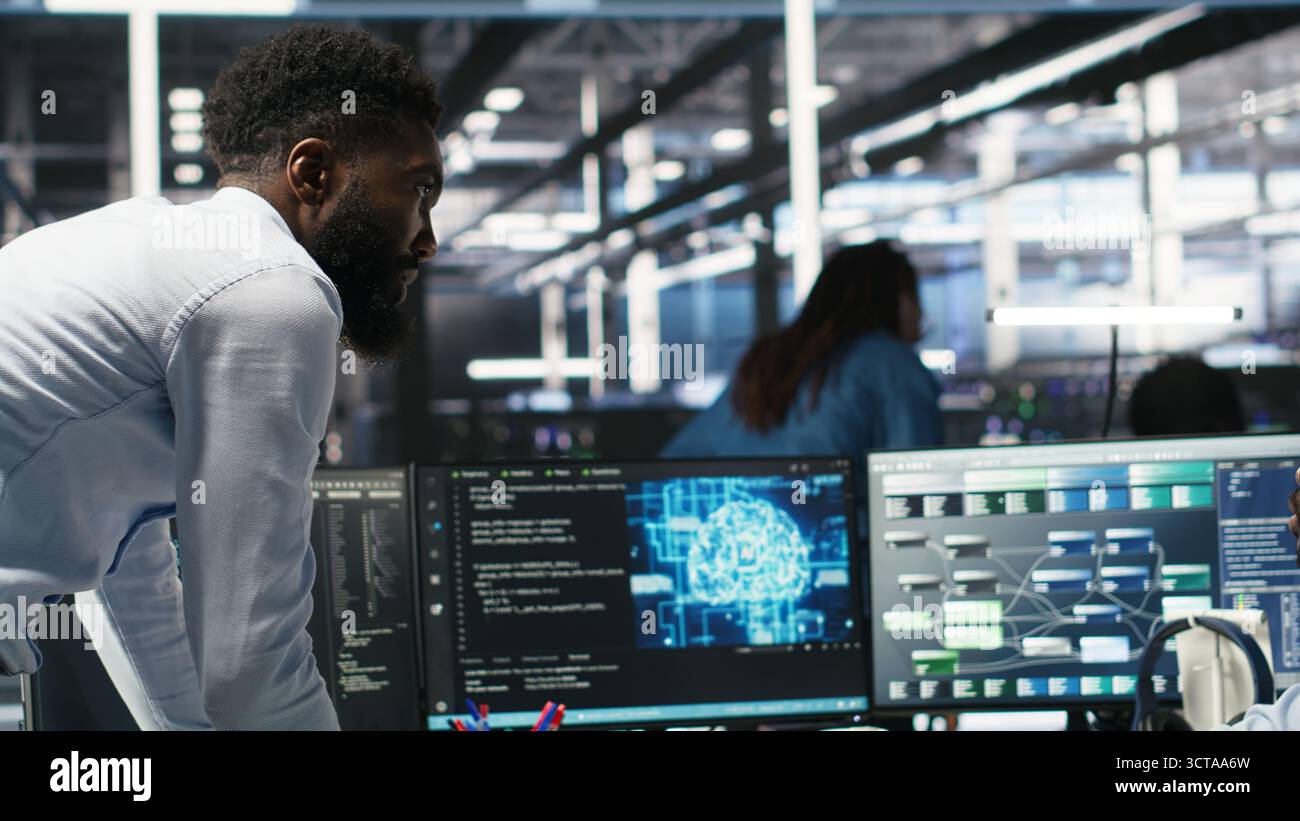 Technician in wheelchair and data center manager using AI node tree ...
