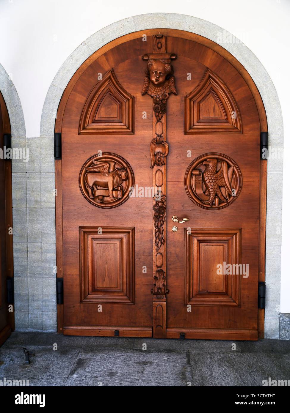 Intricately carved wooden door with animal motifs at historic building ...