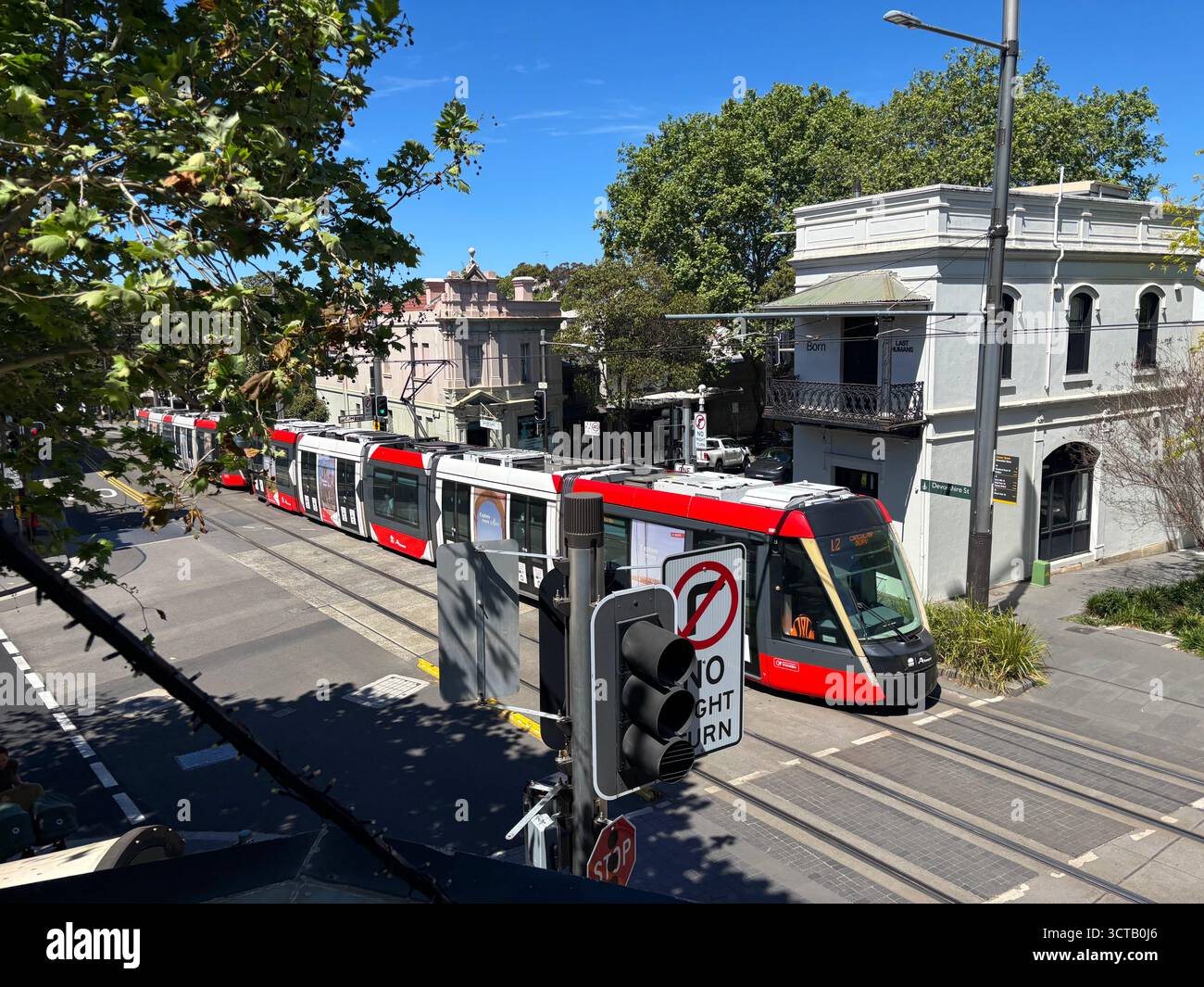 Light rail tram to Circular Quay passing through Crown and Devonshire Street intersection, Surry Hills, Sydney, NSW, Australia. No PR - Smartphone Captured Stock Image