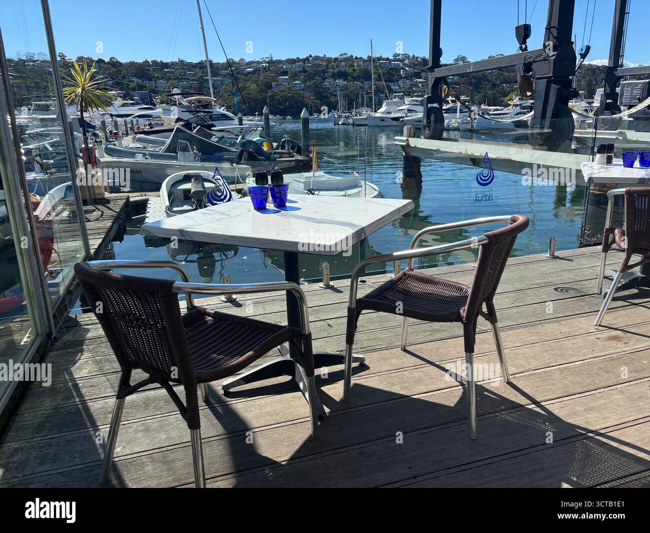 Table for two overlooking marina, Azul restaurant, The Spit, northern Sydney, NSW, Australia. No PR - Smartphone Captured Stock Image