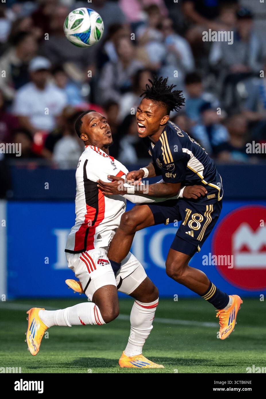 San Jose Earthquakes' Jamar Ricketts, left and Vancouver Whitecaps