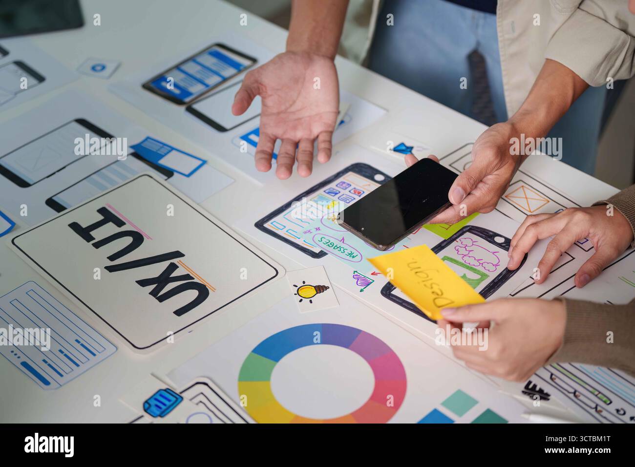Interactive UX Design Session with Prototypes and Mobile Devices Stock Photo