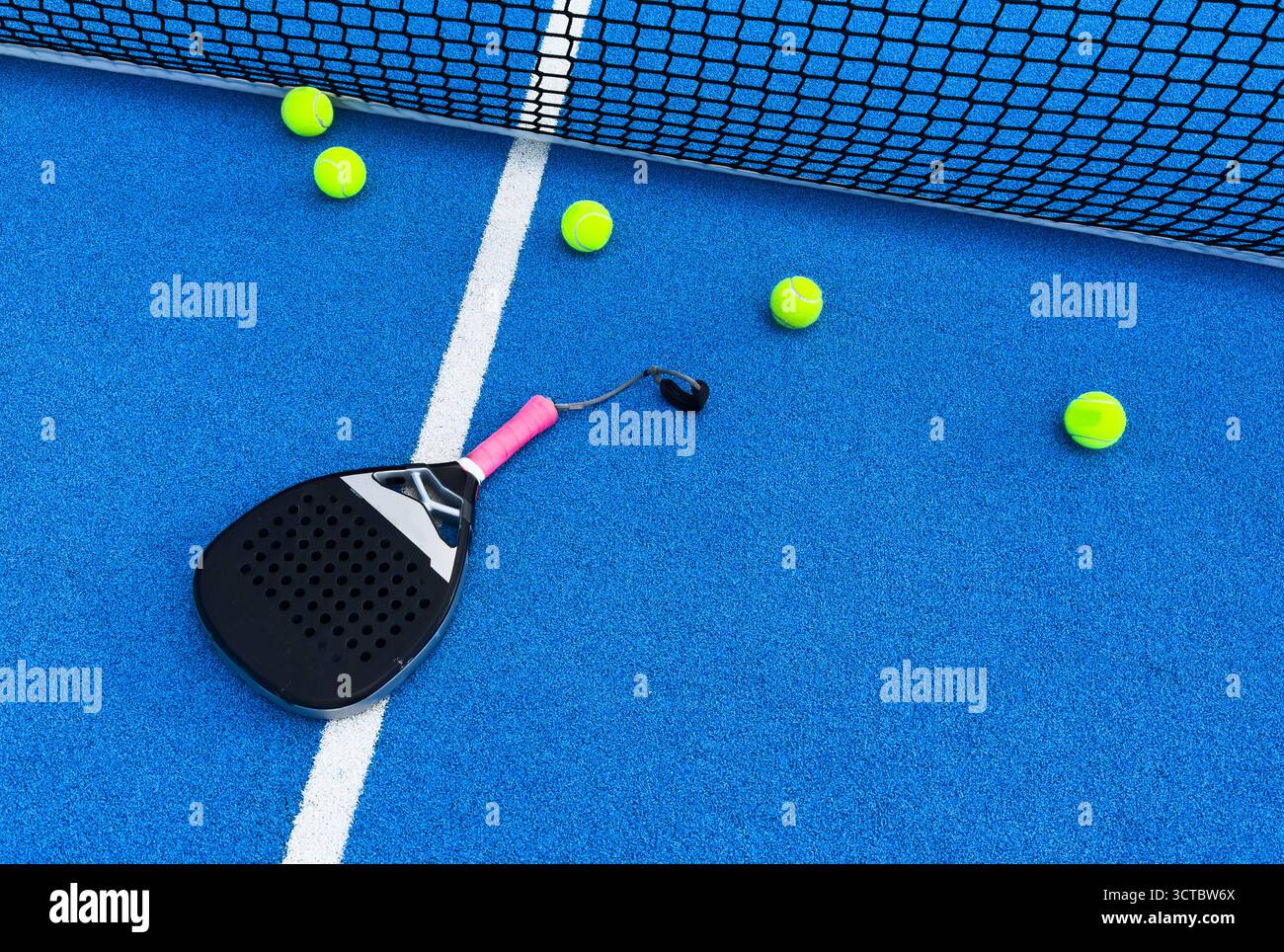 Padel Racket Photo Blue Court padel racket on a padel blue court Stock Photo - Alamy
