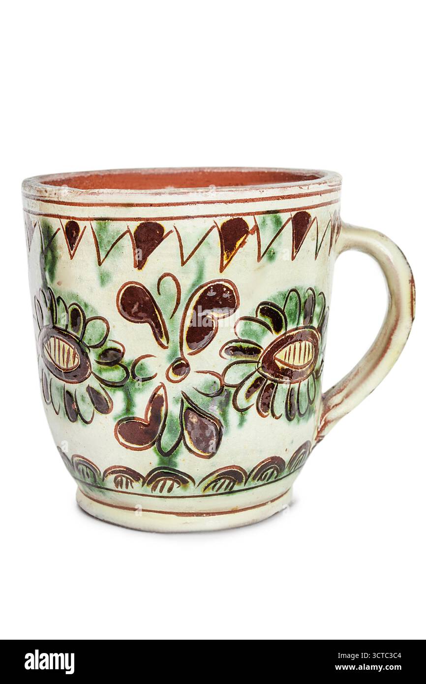 Handmade ceramic painted mug isolated on white background Stock Photo