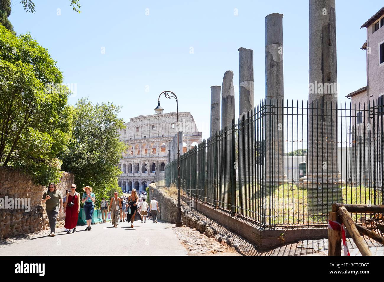 Ancient Roman columns with the Colosseum in the distance Stock Photo ...