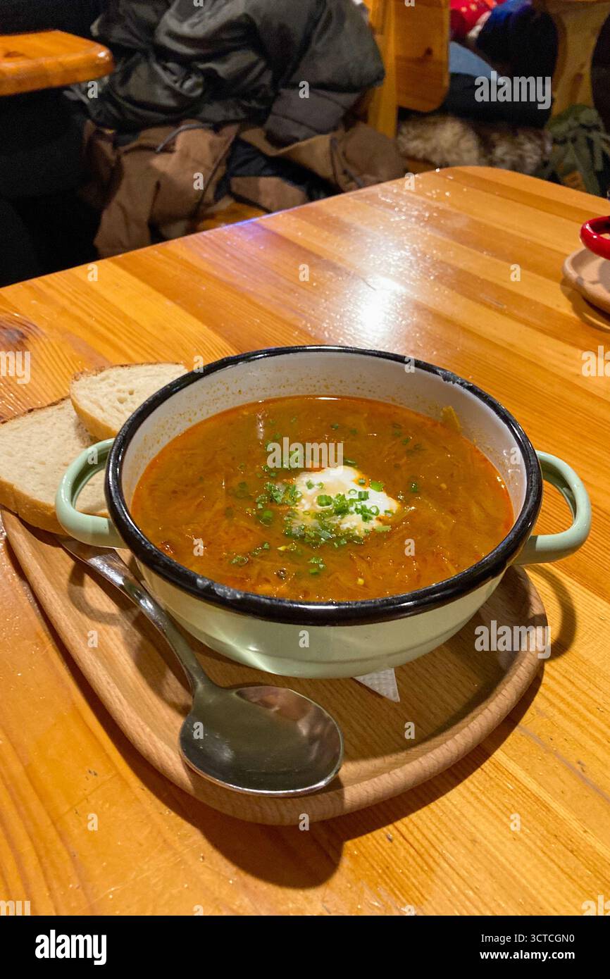Delights of Kapustnica (sauerkraut soup), classic Slovak winter national meal features tangy sauerkraut and a mix of meats like pork and sausage, drie - Smartphone Captured Stock Image