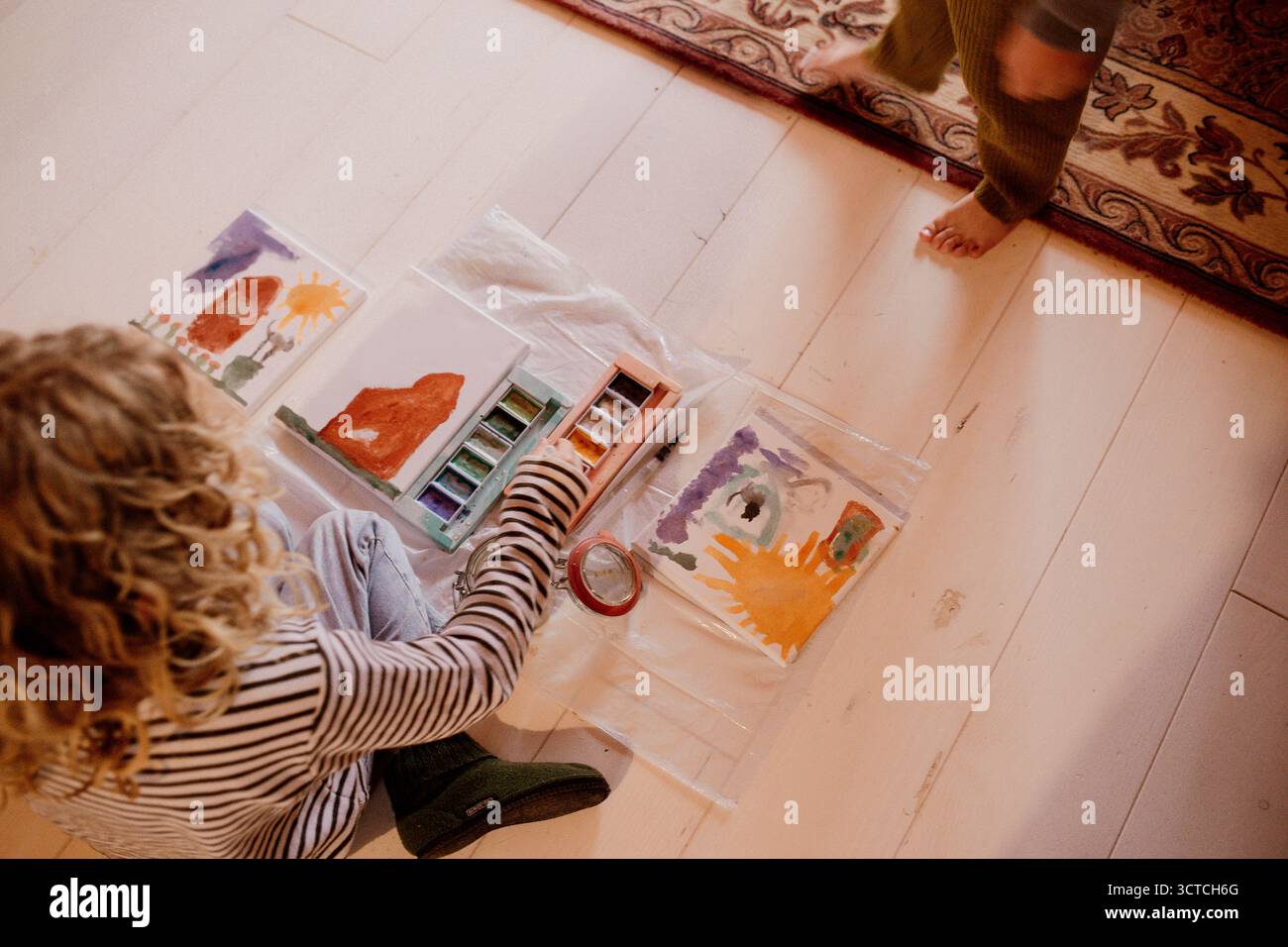 Children painting with watercolors on small canvases Stock Photo - Alamy