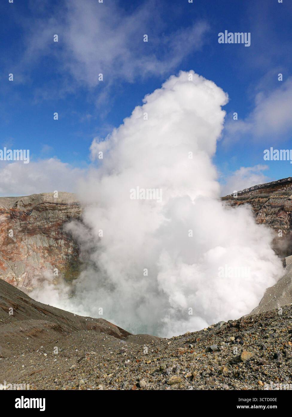 Japan, Kyushu: formed by four gigantic volcanic eruptions, Mount Aso is one of the largest calderas in the world. Mount Naka-dake, located in its cent Stock Photo