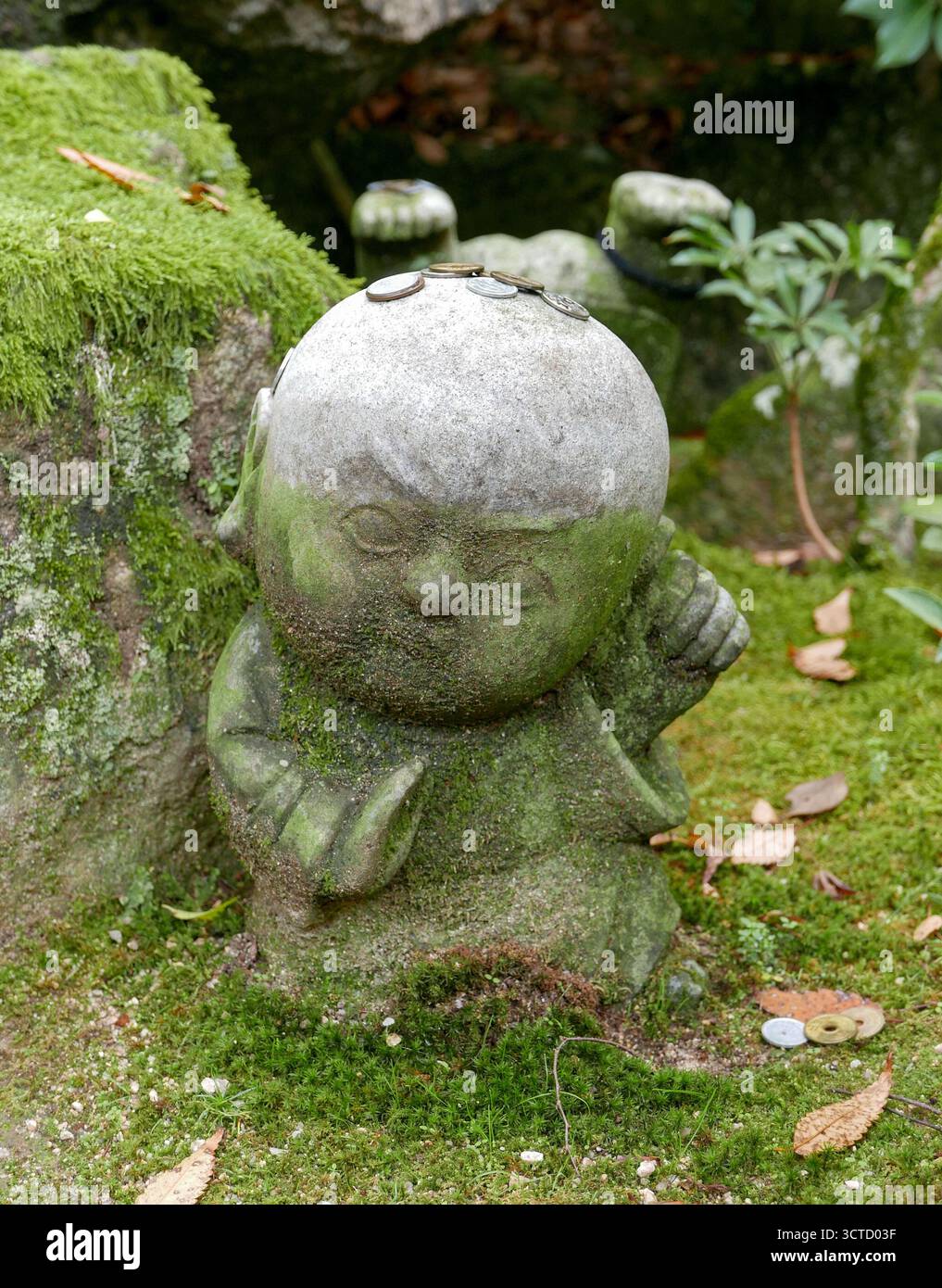 Japan, Miyajima Island: baby Buddha statue at the entrance to Daisho-in Buddhist temple, located at the bottom of Mount Misen on this island in Hirosh Stock Photo