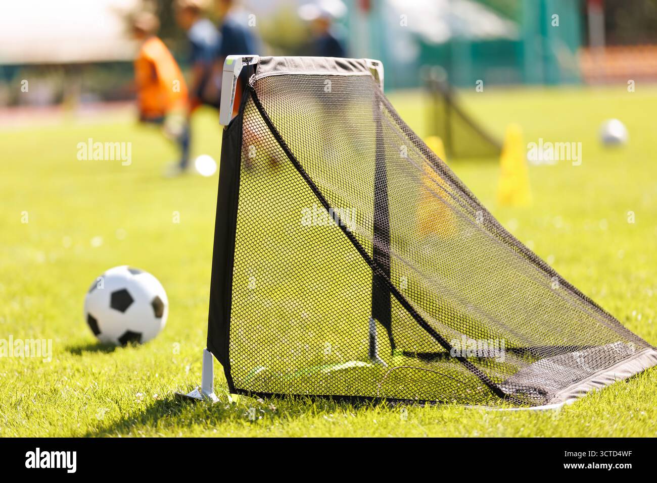 Mini Soccer Goal on Training Field. Youth Football Equipment for Kids ...