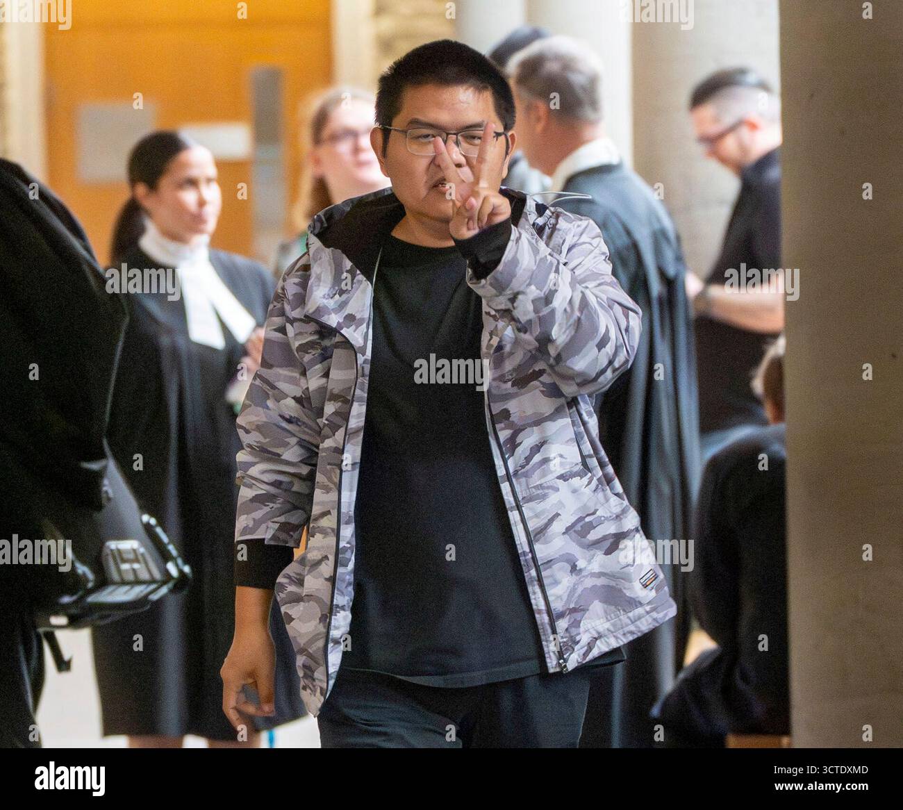 Yuesheng Wang gestures as he arrives for his espionage trial at the ...