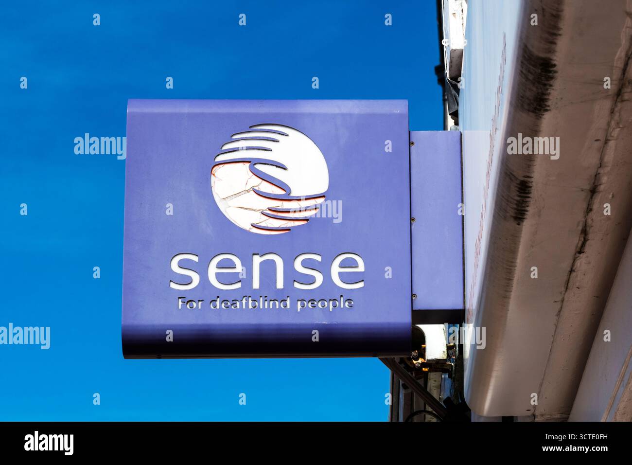 Sence In/sign A sign on a Sense charity shop. The organisation for deaf blind people ...