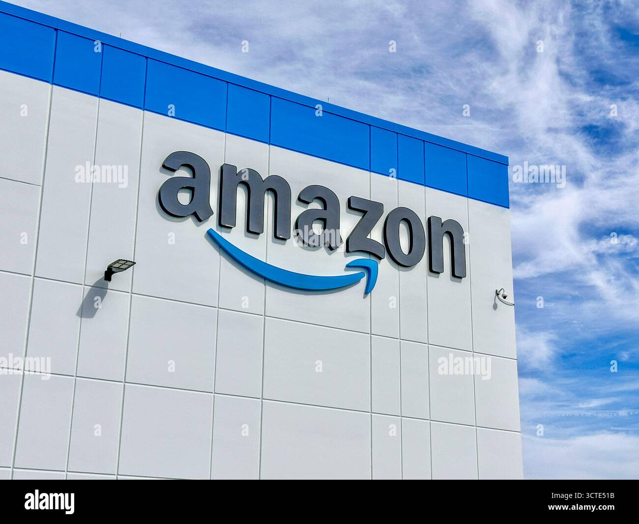 Amazon logo on the outside of an Amazon building - Smartphone Captured Stock Image